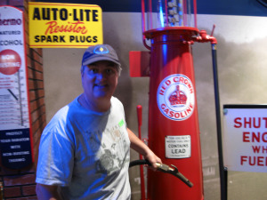 Mike by an old gas pump.  The artifacts are in pristine condition.